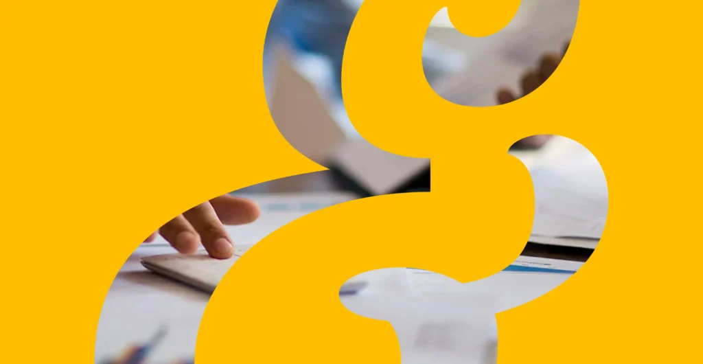 Yellow ampersand overlay on blurred business meeting scene representing B2B tech marketing strategy and campaign planning.
